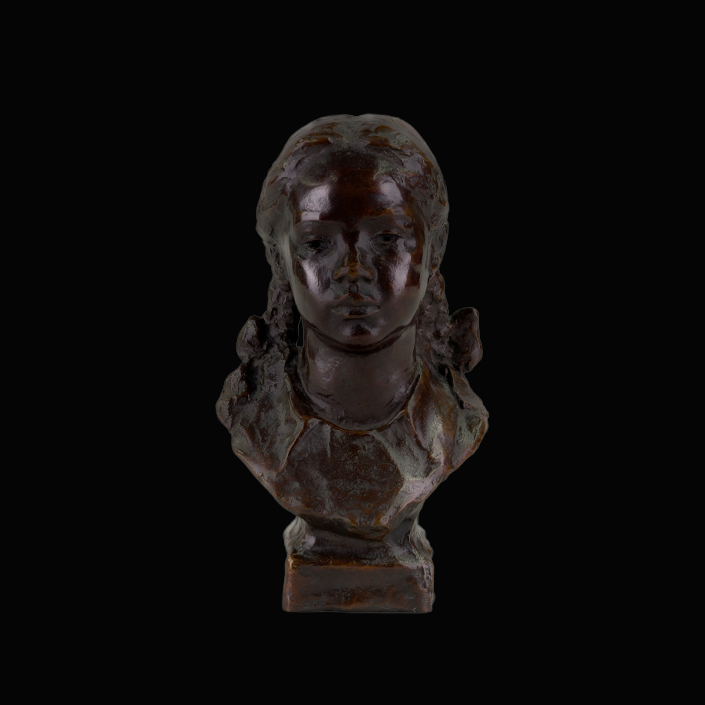 Sculpture of a girl with pigtails hairstyle.