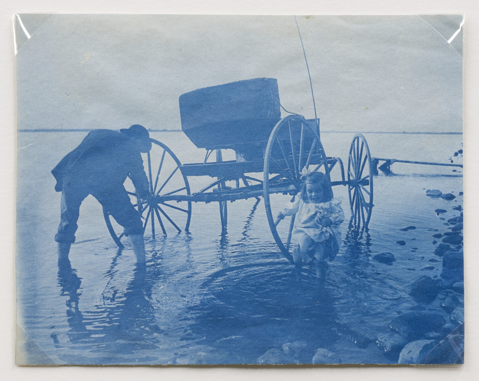 Untitled (Man, Small Girl, and Buggy in Lake)