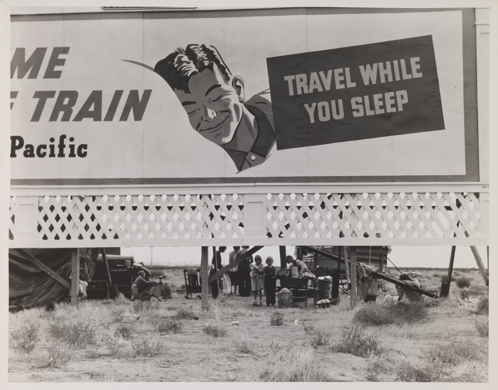 Billboard Along U.S. 99 Behind Which Three Destitute Families of Migrants are Camped. Kern County, California