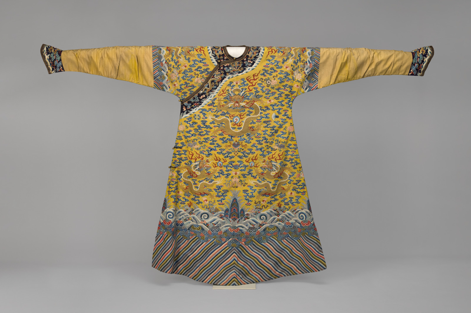 Manchu Imperial Consort’s Semiformal Court Robe with Design of Nine Five-Clawed Dragons Chasing Pearls and Five Symbols of Imperial Authority
