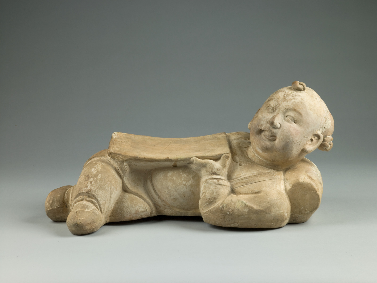 Headrest in the Form of a Reclining Boy